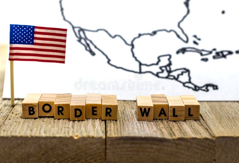 Border Wall USA concept with American flag on white background and wooden board