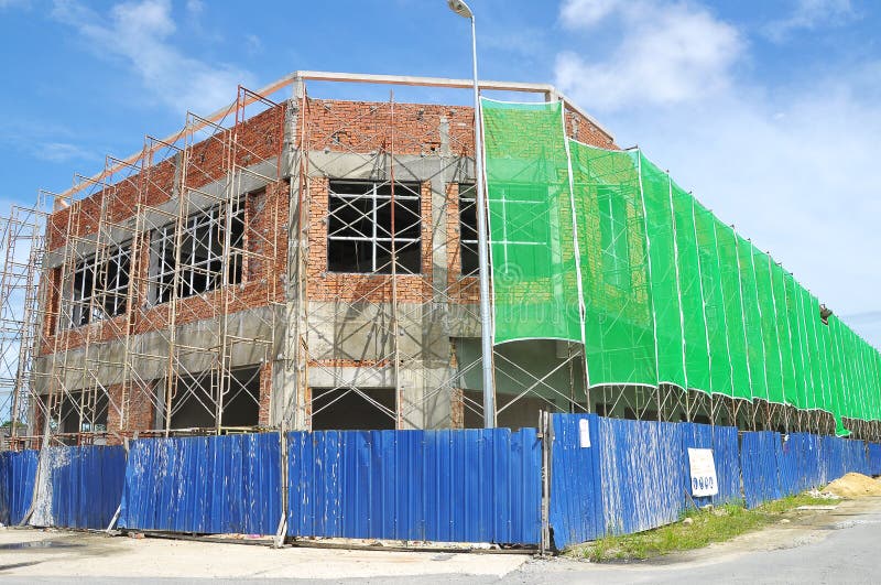 Bordi in costruzione della casa del negozio dall'armatura e dalla sicurezza immagini stock libere da diritti Bordi in costruzione della casa del negozio dall'armatura e dalla sicurezza immagini stock libere da diritti