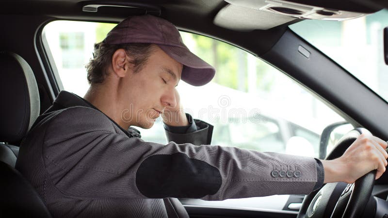 Bored man at the wheel of his car sleeping royalty free stock image Bored man at the wheel of his car sleeping royalty free stock image