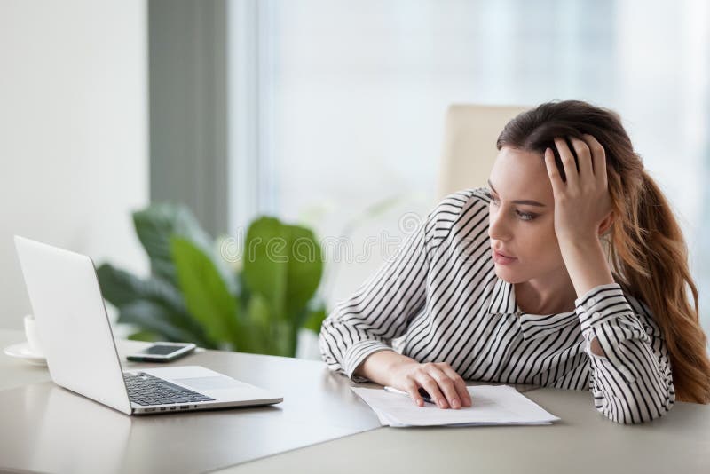 Bored woman worker feel unmotivated at work