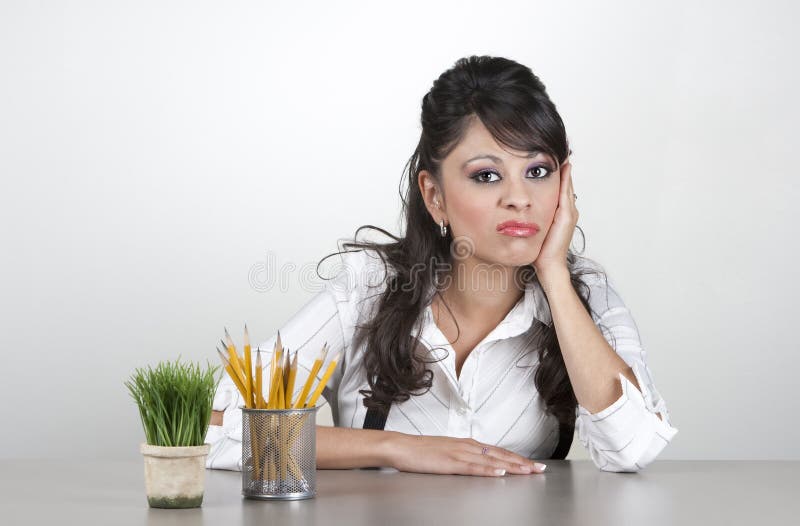 Bored woman at work stock images