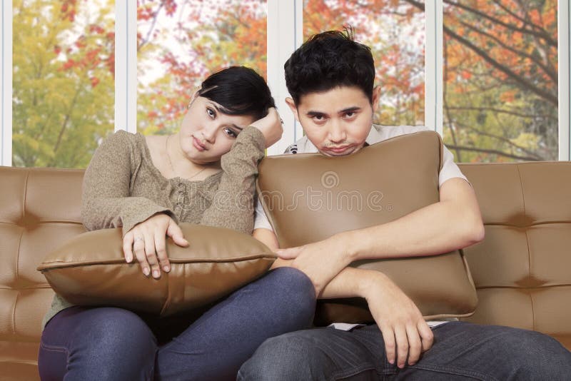 Bored young couple at home stock image Bored young couple at home stock image