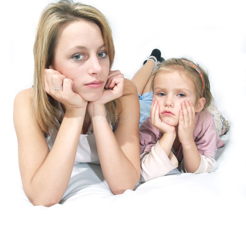 Mother and child sleepy lay on the bad. Boring kid white stock images, royalty-free photos and pictures