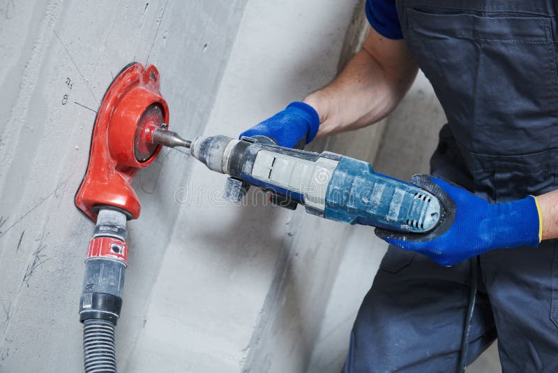Boring Hole for Electric Outlet by Power Tool Drill. Stock Photo