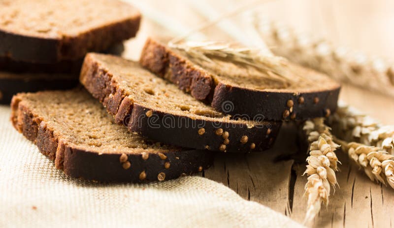 Borodinsky bread slice is a traditional Russian rye-wheat bread with maltose syrup malt and coriander royalty free stock photography Borodinsky bread slice is a traditional Russian rye-wheat bread with maltose syrup malt and coriander royalty free stock photography