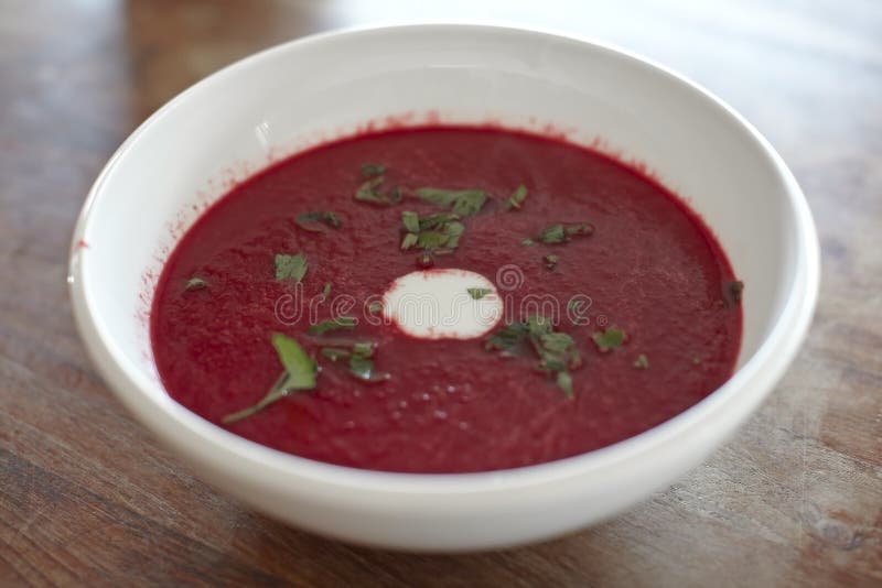 Beet root european soup called borscht with sour cream and parsley. Beet root european soup called borscht with sour cream and parsley.