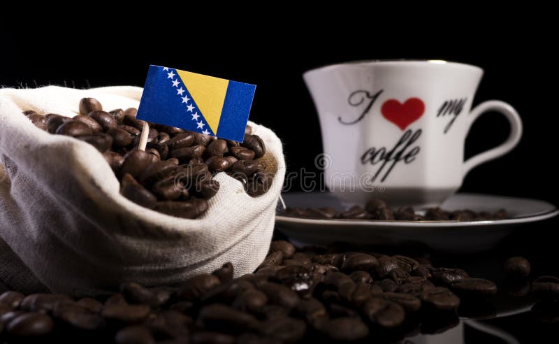 Bosnia and Herzegovina flag in a bag with coffee beans isolated on black stock photo