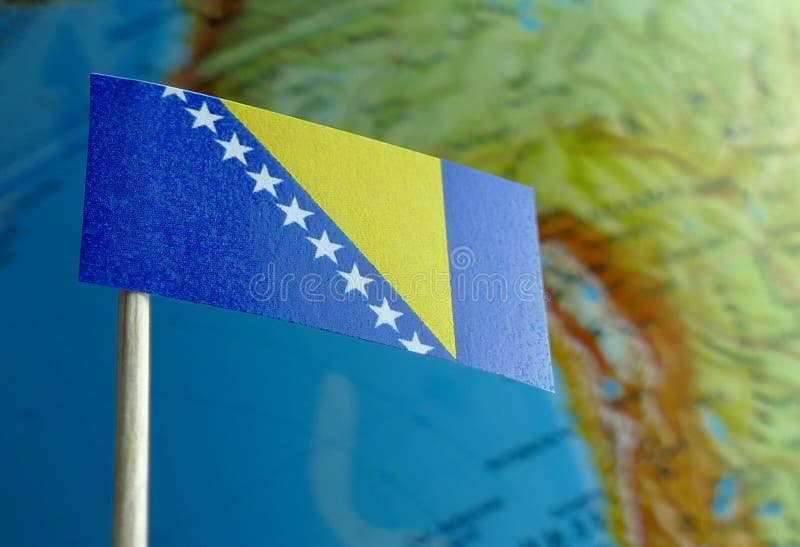 Bosnia and Herzegovina flag with a globe map as a background stock photography
