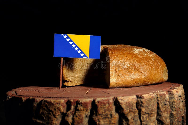 Bosnia and Herzegovina flag on a stump with bread royalty free stock images