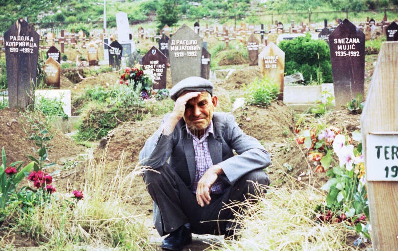 Naim Pasic mourns the loss of his wife and daughter at Lion cemetary in Sarajevo, Bosnia, on Wednesday, June 2, 1993. Pasic, 58, had left his home in Sarajevo to gather food for his family, and upon his return found his home destroyed and his family dead. Tens of thousands of Bosnian civilians have died in the year-old civil war. Photographer: Mark Milstein/ Northfoto *** Local Caption ***. Naim Pasic mourns the loss of his wife and daughter at Lion cemetary in Sarajevo, Bosnia, on Wednesday, June 2, 1993. Pasic, 58, had left his home in Sarajevo to gather food for his family, and upon his return found his home destroyed and his family dead. Tens of thousands of Bosnian civilians have died in the year-old civil war. Photographer: Mark Milstein/ Northfoto *** Local Caption ***