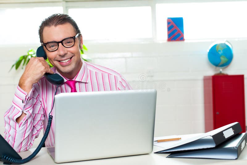 Boss on a business call clinches the deal stock image Boss on a business call clinches the deal stock image