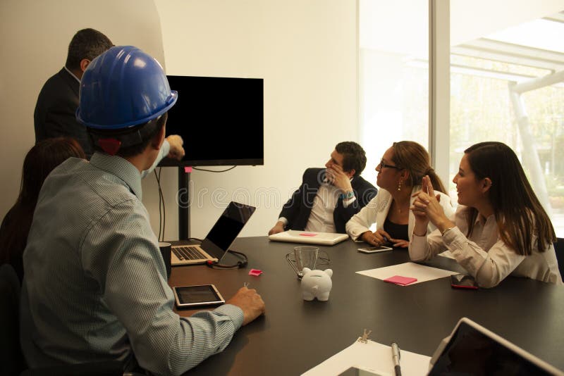 Boss Giving a Presentation To His Team in the Boardroom Based on