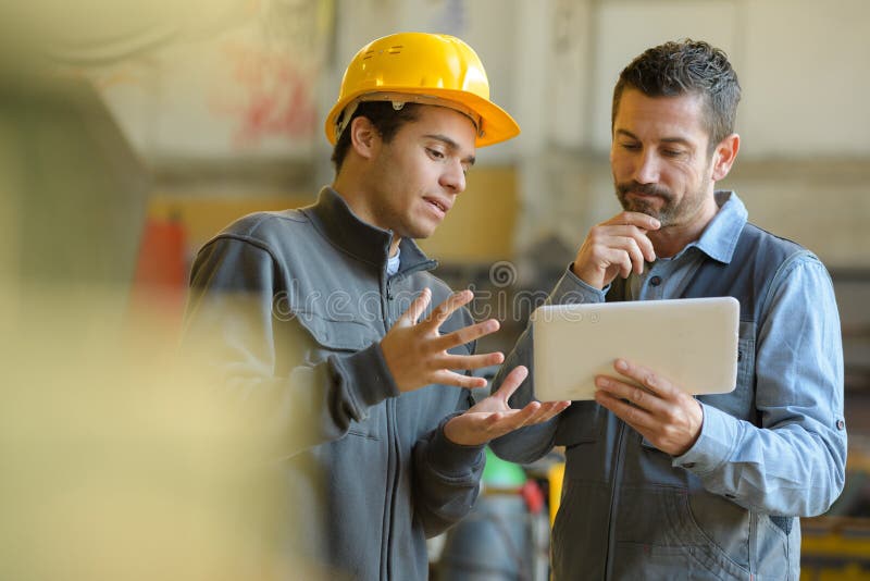 Boss and Worker Checking Results on Tablet Stock Image Image of