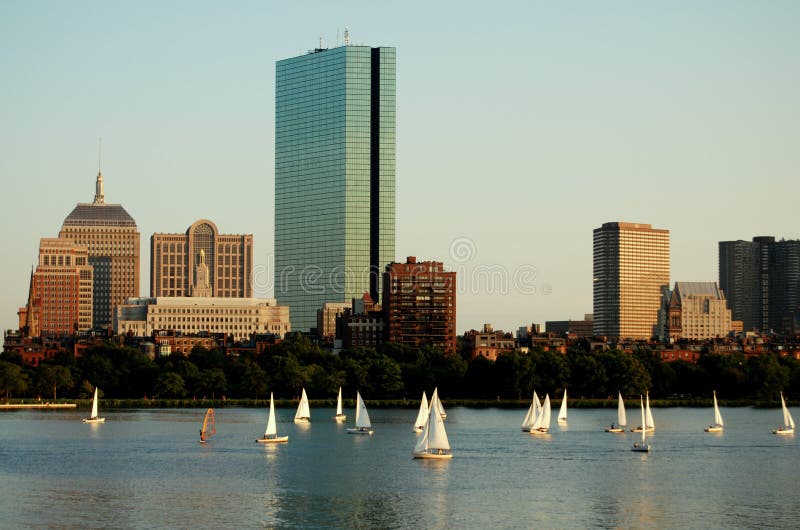 Sailboats on the Charles River and the glass 1975 sixty story Hancock Tower in Copley Square designed by famed architect I. M. Pei. The original Hancock Building (with cupola) stands on the left in Boston, Massachusetts. Sailboats on the Charles River and the glass 1975 sixty story Hancock Tower in Copley Square designed by famed architect I. M. Pei. The original Hancock Building (with cupola) stands on the left in Boston, Massachusetts.