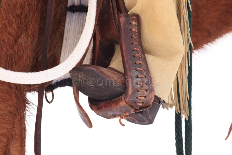 Botas de vaqueiro nos estribos fotografia de stock royalty free Botas de vaqueiro nos estribos fotografia de stock royalty free