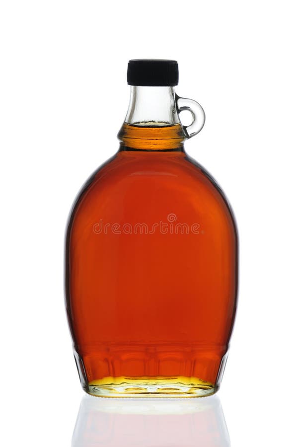 Botella del jarabe de arce fotografía de archivo