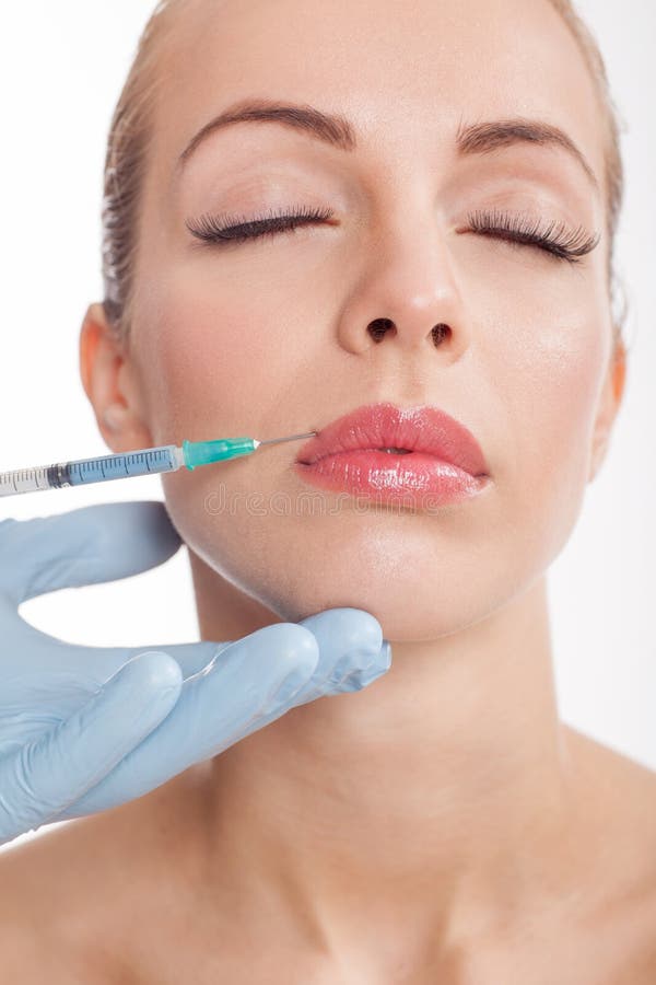 Botox tiró en los labios femeninos foto de archivo libre de regalías Botox tiró en los labios femeninos foto de archivo libre de regalías