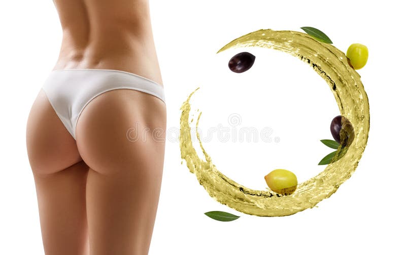 Female buttocks near swirl olive oil. Slimming and dieting concept. Over white background. Female buttocks near swirl olive oil. Slimming and dieting concept. Over white background.