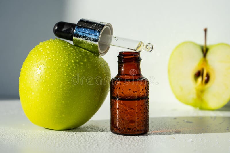 Apple Essential Oil on a Wooden Table Near Ripe Red Apples. Essential Oil  is Used To Fill Lamps, Perfumes and in Cosmetics Stock Photo - Image of  hygiene, herbal: 163070280