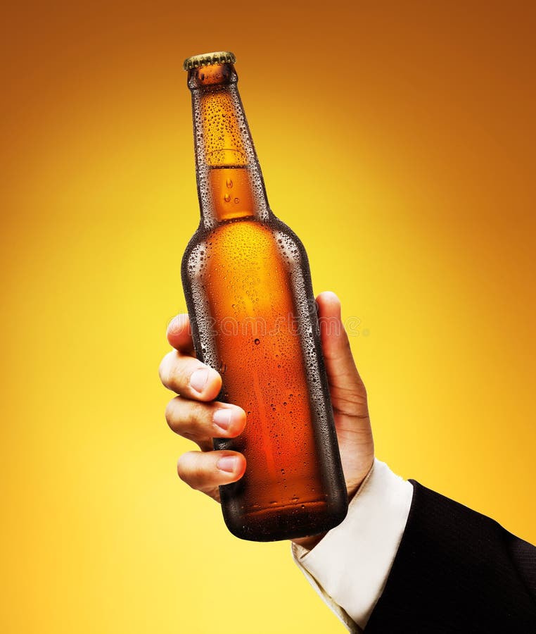 Bottle of beer in a man s hand