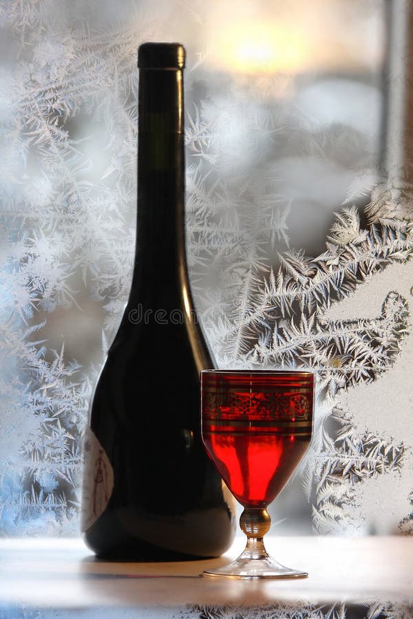Bottle bottle of red wine on wintry background