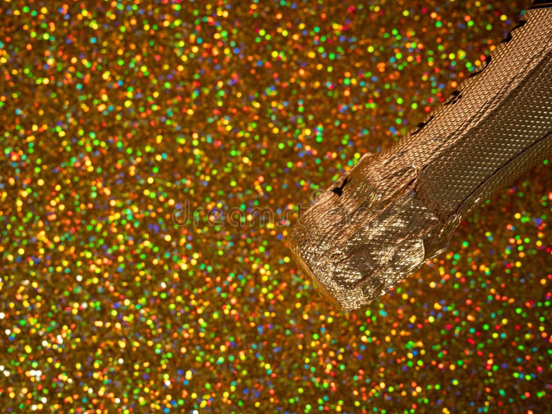 Bottle of Champagne with Gold Glitter on a Shiny Background. Stock