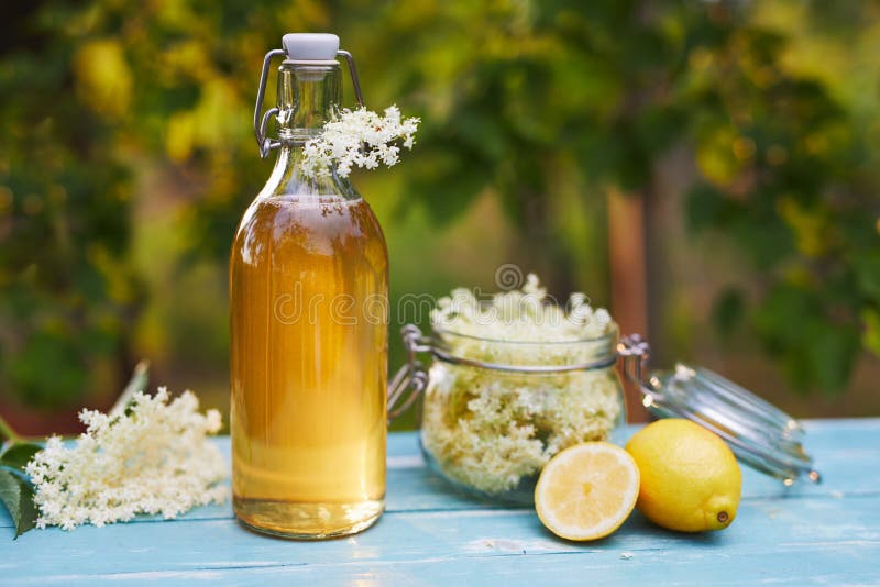 Elderflower Syrup with Lemon and Dried Elderberries Stock Photo Image