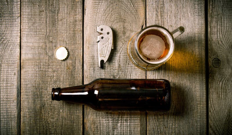 Bottle , glass of beer, bottle opener, cork