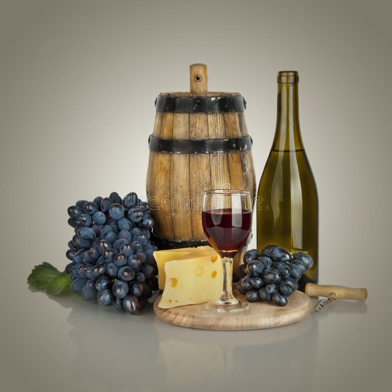 Bottle, Glass of Wine, Ripe Grapes and Cheese Isolated on White Stock