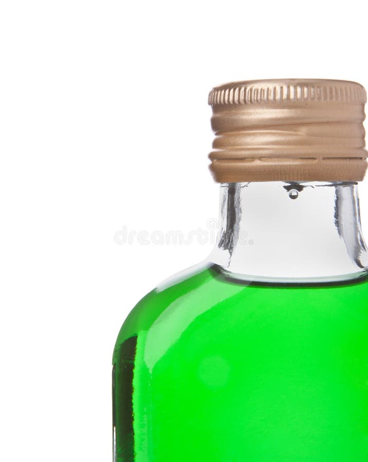 Bottle with green alcohol stock photo. Image of liqueur 18101770
