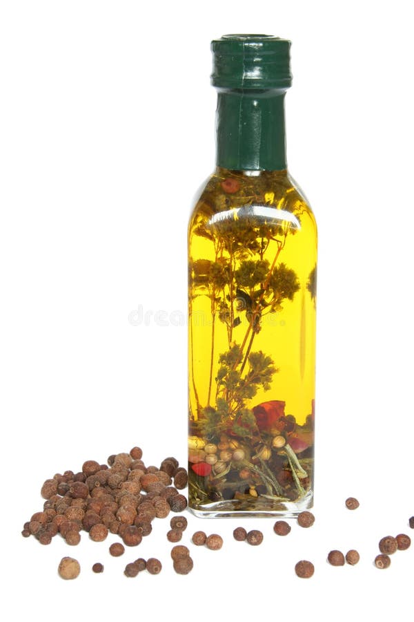 Bottle of olive oil with spices and herbs