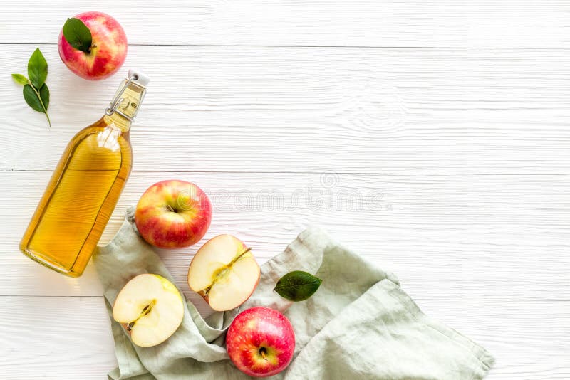 Bottle of Organic Apple Cider Vinegar with Red Apples Stock Photo