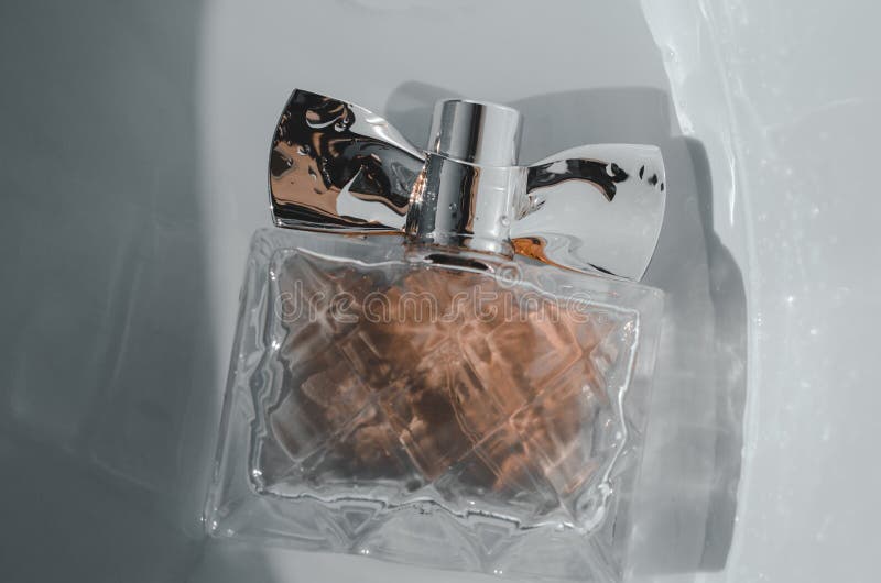 A Bottle of Perfume in Water Stock Photo Image of pool, background