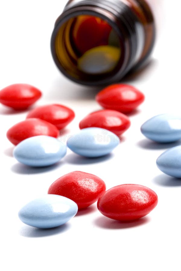 Bottle with red and blue pills