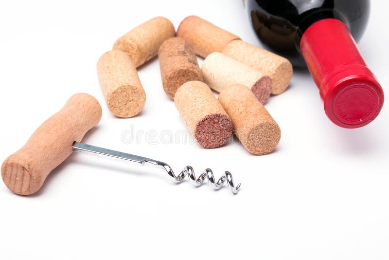 Bottle of red wine, corks and corkscrew