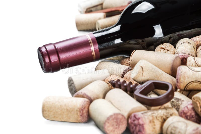 bottle with red wine and wine stoppers isolated