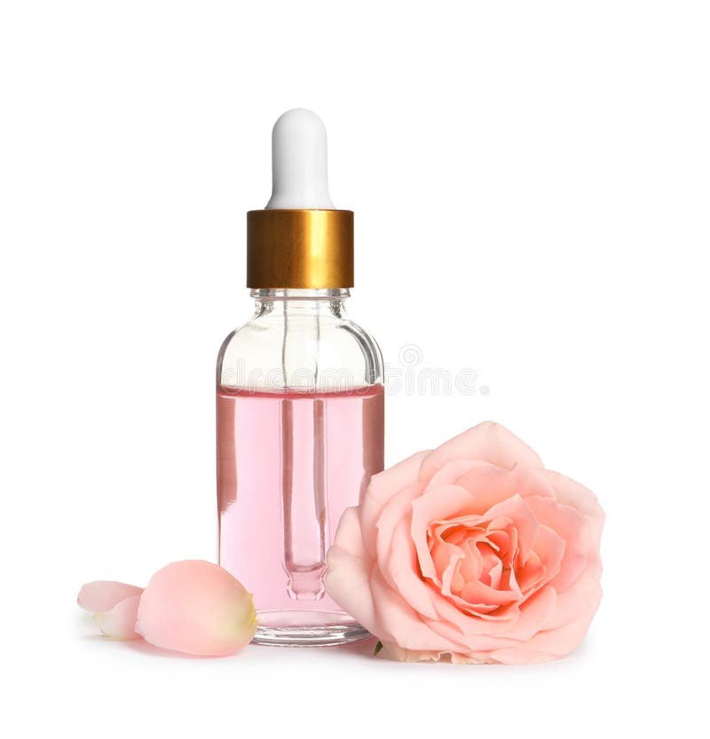 Bottle of rose essential oil and flower on white