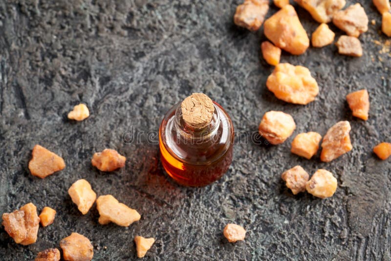 A Bottle of Styrax Benzoin Essential Oil and Benzoin Resin Stock Image
