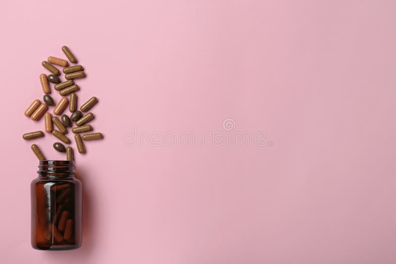 Bottle with vitamin capsules on color background. Space for text