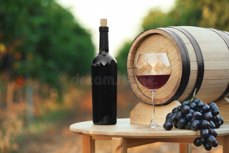 Bottle of wine, barrel and glass on wooden table royalty free stock photo Bottle of wine, barrel and glass on wooden table royalty free stock photo