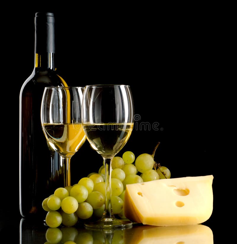 Bottle of wine, a bunch of white grapes and a piece of cheese