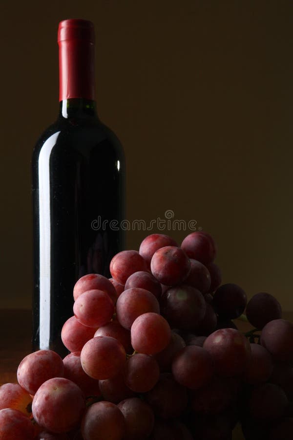 Bottle of wine and grapes