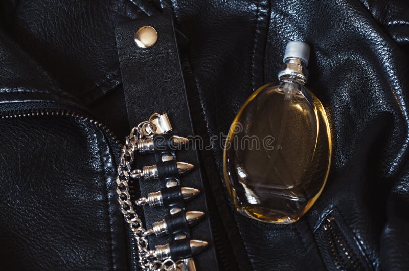 A Bottle of Women S Perfume on a Black Leather Jacket. Women S Perfume