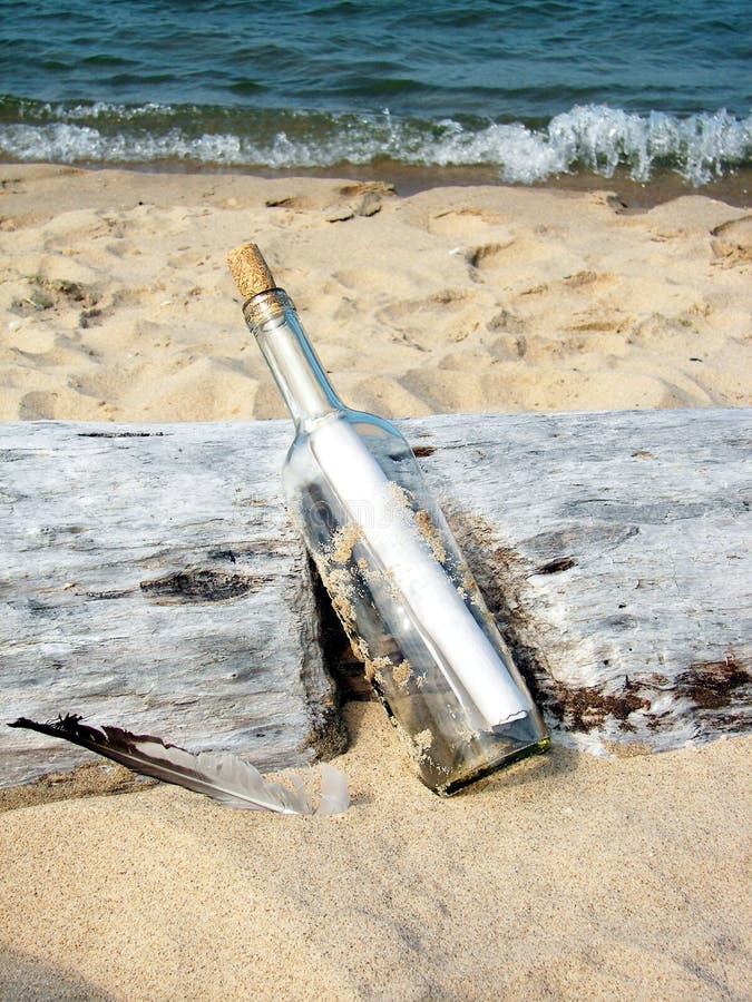 message in a bottle on driftwood