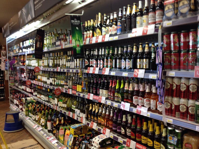 Bottles Of Alcohol In A Display Cabinet Editorial Stock Image