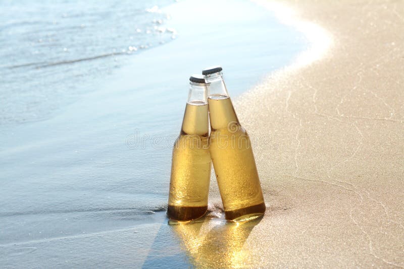 Bottles of Cold Beer on Sandy Beach Near Sea Stock Photo Image of