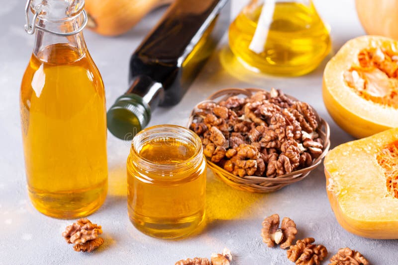 Bottles with Different Types of Vegetable Oil. Walnut Oil and Pumpkin
