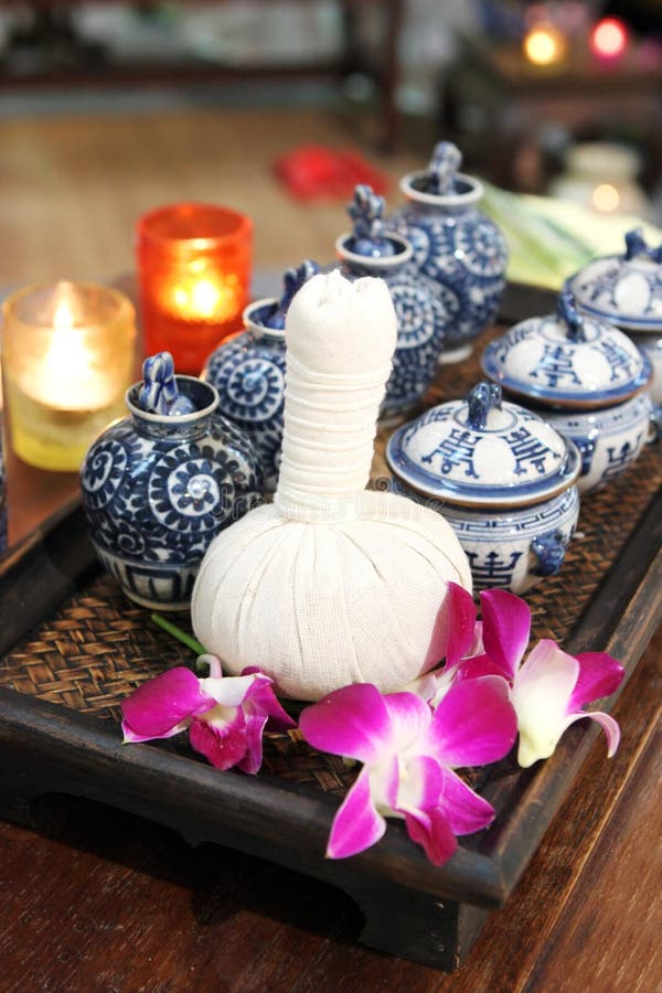 Bottles of herbal spa oils and flowers.