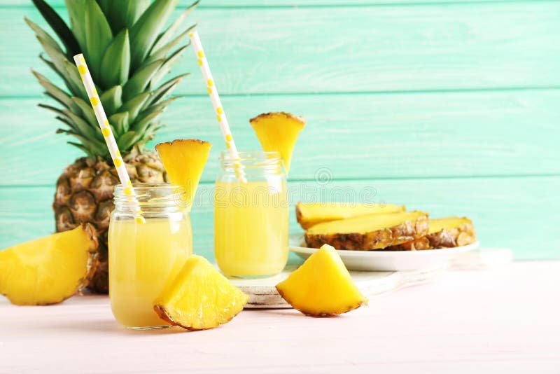 Bottles of pineapple juice stock photo. Image of beverange 65573078