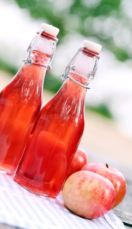 Bottles with Red Drinks and Some Apples Stock Image Image of apples
